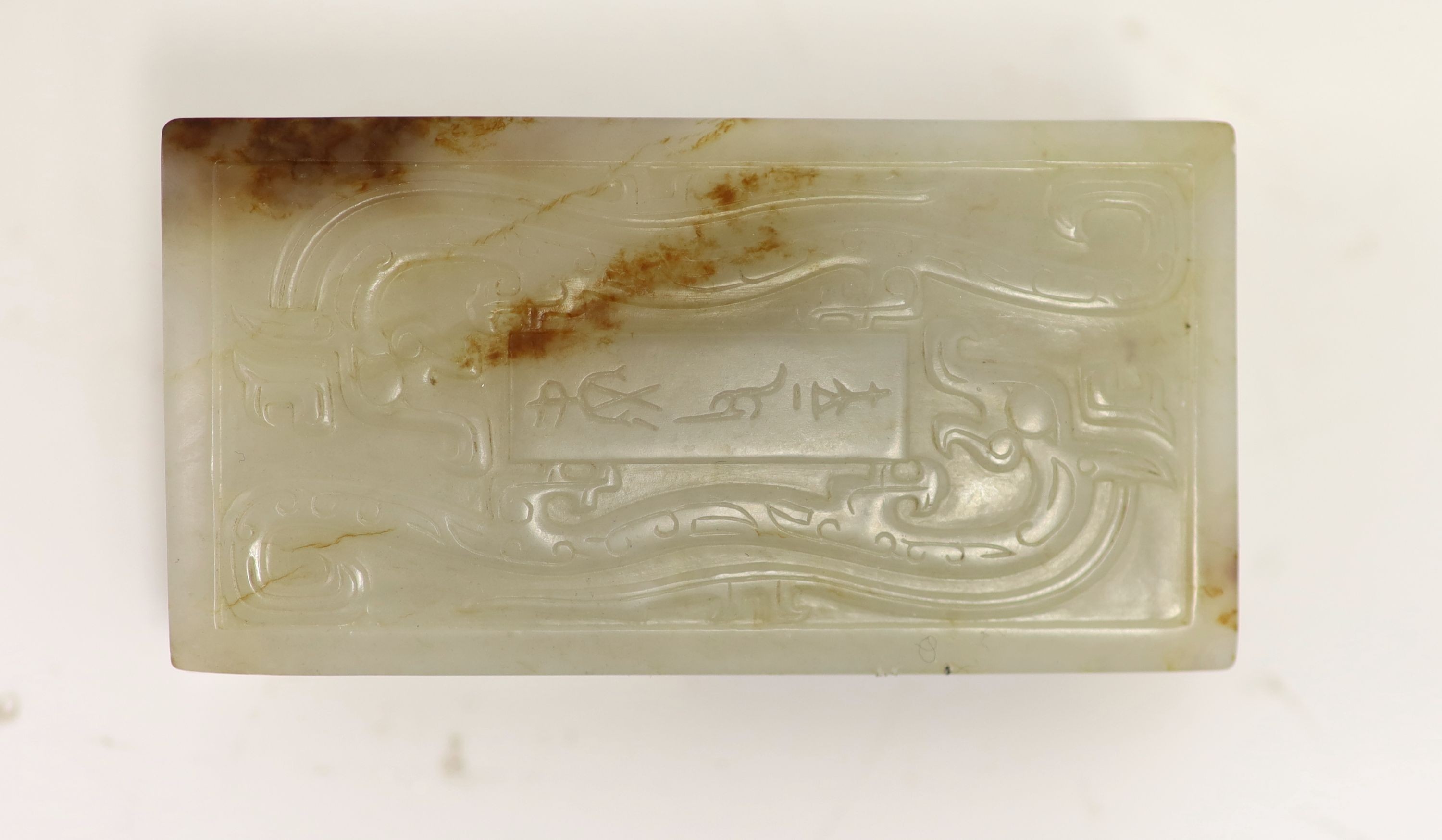 A Chinese archaistic white and brown jade box and cover, 8.3 x 4.3 cm